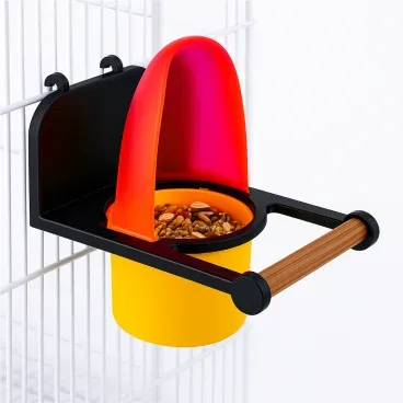 Comedouro-com-Poleiro-para-Passaros-Food-Clean-Animalissimo-Rosa-pendurado-na-gaiola-e-com-sementes-dentro